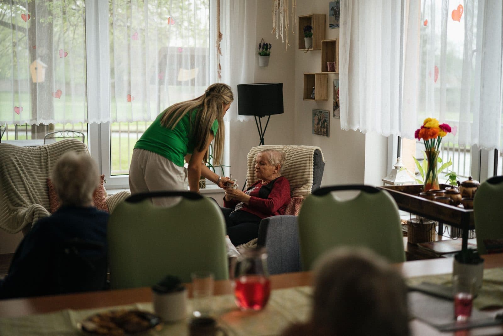 A care worker supporting an elderly resident