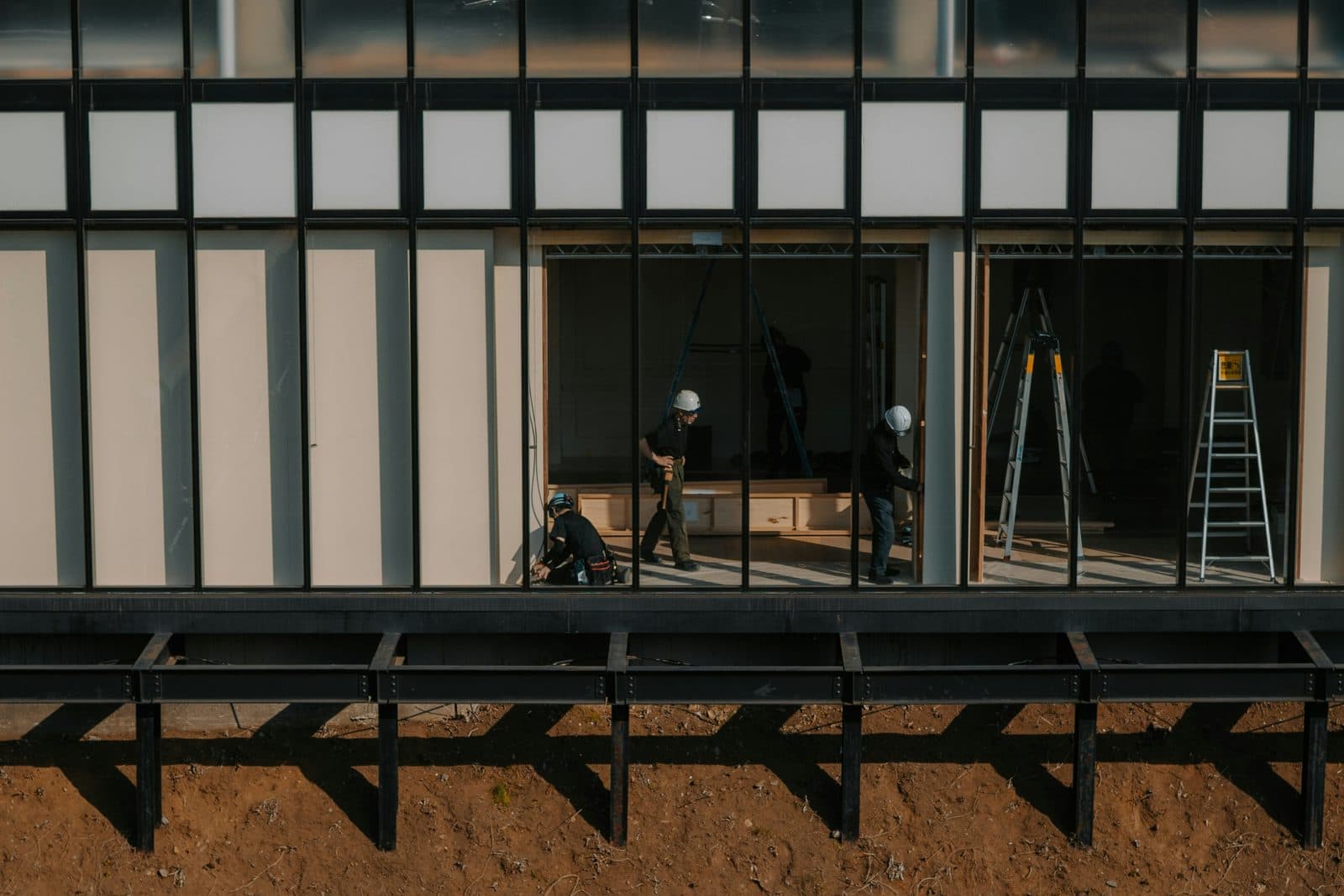 Construction workers reviewing plans on site