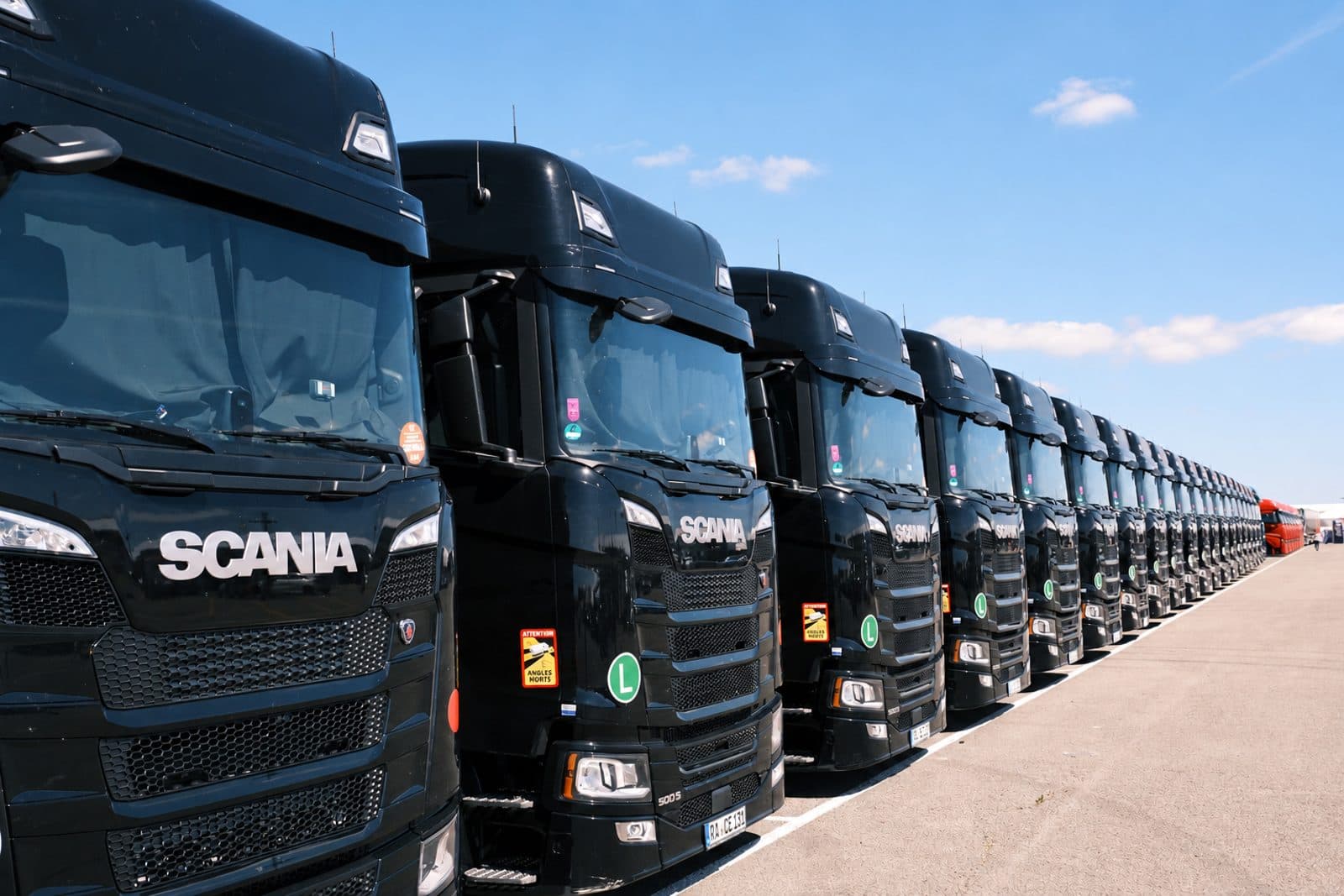 An HGV driver beside a lorry